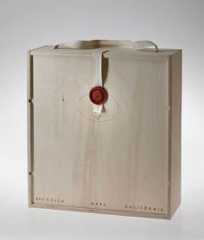 a wooden box with a red wax stamp on the front and bottom, sitting open