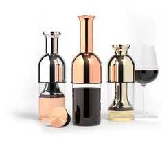 three different types of wine glasses and bottles