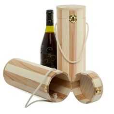 a bottle of wine in a wooden box next to a corkscrew container with rope