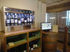 there is a wine bar with several bottles on it