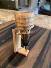 a wood turning device on top of a wooden table