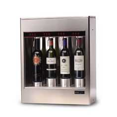 a wine dispenser with four bottles in it