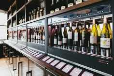 several bottles of wine are on display in a store