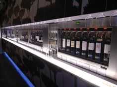 a row of wine glasses sitting on top of a counter