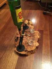 a wine glass holder on a wooden table