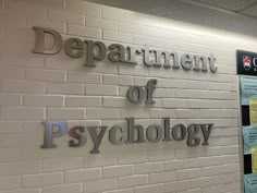 there is a sign on the wall that says department of psychology