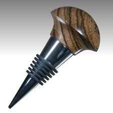 a close up of a wood and metal object on a white background with clippings