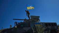 Ukrainian soldier on top of a South African Mbombe 6 armored fighting vehicle. Photo: NMFTE via Telegram