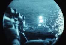 U.S. Marine Corps Sgt. Yoel Rhe, a scout team leader with Weapons Company, Battalion Landing Team 3/5, 11th Marine Expeditionary Unit, provides aerial sniper coverage from a UH-1Y Venom attached to Marine Medium Tiltrotor Squadron (VMM) 163 (Reinforced), 11th MEU, during a visit, board, search and seizure exercise in the Pacific Ocean, Feb. 2, 2026. The 11th MEU is currently underway aboard the Boxer Amphibious Ready Group in the U.S. 3rd Fleet area of operations conducting integrated training that enhances lethality and warfighting readiness. (U.S. Marine Corps photo by Sgt. Joseph Helms)