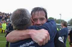 Yeovil Town versus Hull City. Tigers captain Ian Ashbee hugs manager Peter Taylor after winning promotion.