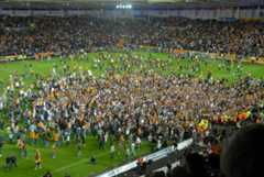Hull City fans invade the pitch after the play-off win over Watford