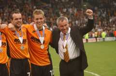 Former Hull City boss Peter Taylor, right, celebrates promotion from League One alongside Danny Allsopp, centre, and Stuart Elliott