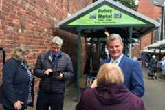 Stuart Andrew (right) talking to constituents outside Pudsey Market