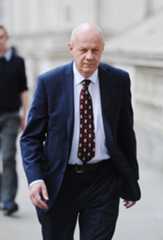 Damian Green walks towards Downing Stree