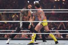 Roman Reigns and CM Punk during their Triple Threat match (which also involved Seth Rollins) at WrestleMania 41 earlier this year