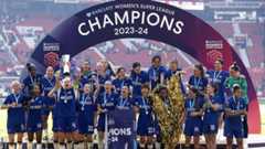 Chelsea celebrate with the Women's Super League trophy