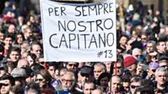 Fans hold banner outside Davide Astori funeral