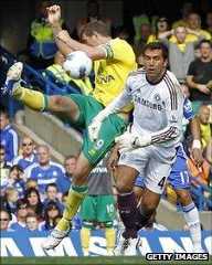 Grant Holt hooks in the equaliser past a bemused Hilario