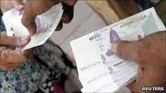 Riels changing hands