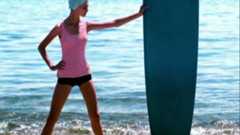 Woman with surfboard