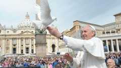 Pope Francis releases a white dove in St Peter's Square (15 May 2013)