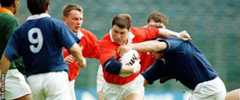 Scott Gibbs in action for Wales against Italy in October 1996