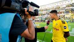 Jadon Sancho is interviewed on the pitch after a game