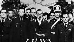 General Orlando Ramon Agosti (R) and Admiral Emilio Massera (L) stand as Lieutenant General Jorge Rafael Videla (C), President of Argentina, takes an oath as 38th president of the Argentine Republic, 29 March 1976, in Buenos Aires.