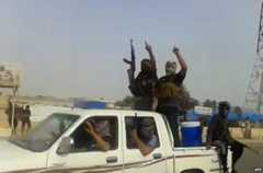 Alleged ISIS militants in the town of Baiji (taken from a video posted on 17 June)