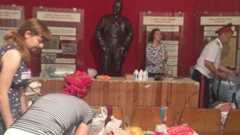 Lenin looks on at the museum of coal as volunteers and Cossacks pack humanitarian aid for Ukrainian refugees