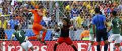 Guillermo Ochoa makes a save from Stefan de Vrij