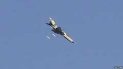 A warplane operated by forces of Syria's President Bashar Al-Assad carries out what activists said was an air raid around al-Tabqa military base at a government-controlled airport that is surrounded by militants, west of Raqqa city, August 21, 2014