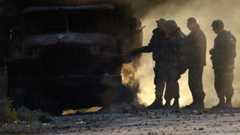 Ukrainian army soldiers check results of overnight shelling in Mariupol, 7 Sept