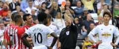 Wilfried Bony is shown the red card