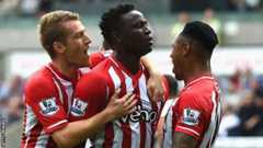 Victor Wanyama (centre) celebrates his goal at the Liberty Stadium