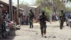 Nigerian troops patrolling in the streets of the remote northeast town of Baga, Borno State on 30 April 2013
