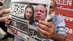 Man holding out a newspaper