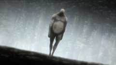 A Titan walks towards a village