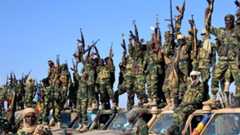 Chadian soldiers gather on February 1, 2015 near the Nigerian town of Gamboru, just accros the border from Cameroon