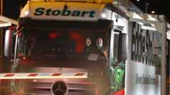 The first lorry, driven by Slavi Ivanov Shumeykov, loads onto Le Shuttle at the Eurotunnel in Folkestone, Kent, after the UK leaves the single market and customs union, and transitional trading arrangements expired at 11pm UK time