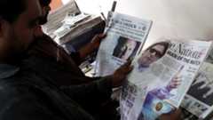 A man reads a Pakistani newspaper with a picture of Imran Khan, head of Pakistan Tehrik-e-Insaf (PTI) political party, on the front page a day after general elections in Karachi, Pakistan, 26 July 2018