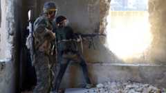 File photo showing Syrian rebel fighters in Ramouseh district of Aleppo (6 August 2016)