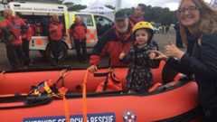girl in search and rescue boat