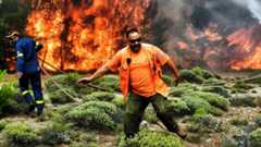 Firefighters tackle a blaze in Greece