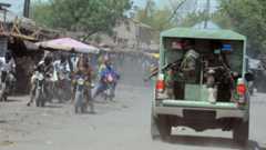 Joint Military Task Force (JTF) patrol the streets of restive north-eastern Nigerian town of Maiduguri, Borno State, on 30 April 2013