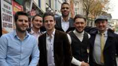 A group of men celebrate the occasion