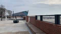 Flood wall with The Deep in the background