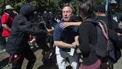 KCRA TV reporter Mike Luery runs from members of group called ANTIFA Sacramento (Anti-Fascism Action). 26 June 2016