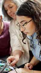 An older woman training a younger woman