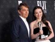 (L-R) US director Sean Baker and US actress Mikey Madison pose with the Best Picture award for "Anora" in the press room during the 30th Annual Critics Choice Awards at Barker Hangar in Santa Monica, California, on February 7, 2025. (Photo by Michael Tran / AFP)